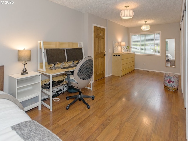 1339 NW 7th Ave, Camas, WA 98607 - home office featuring light wood finished floors, a textured ceiling, and baseboards