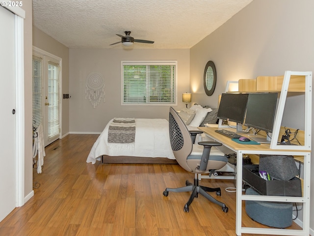 1339 NW 7th Ave, Camas, WA 98607 - bedroom with wood finished floors, an office area, baseboards, and a textured ceiling
