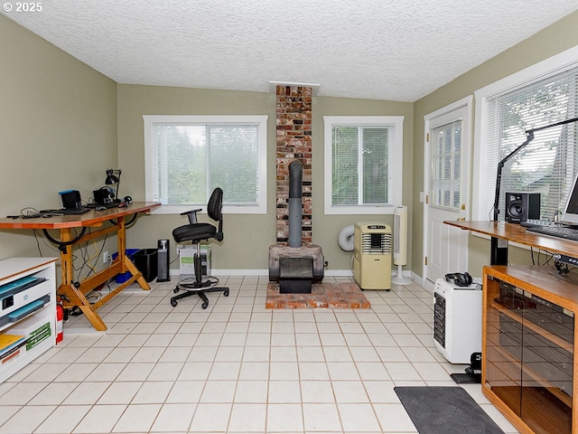 1339 NW 7th Ave, Camas, WA 98607 - home office featuring plenty of natural light, light tile patterned floors, a textured ceiling, and a wood stove