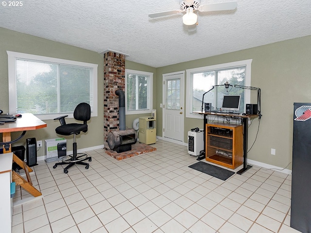 1339 NW 7th Ave, Camas, WA 98607 - office space with a wood stove, baseboards, tile patterned flooring, a textured ceiling, and ceiling fan