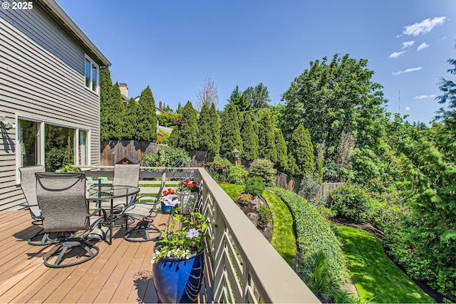 9122 NW Wood Rose Loop, Portland, OR 97229 - deck featuring outdoor dining space and a fenced backyard