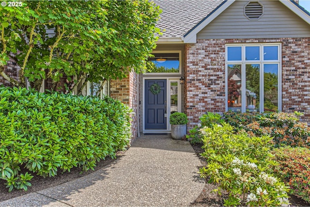 9122 NW Wood Rose Loop, Portland, OR 97229 - entrance to property with brick siding and a shingled roof