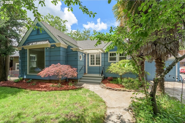 view of front of house with a shingled roof