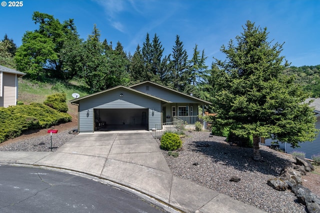 128 NW Woodrose Ct, Roseburg, OR 97471 - view of front facade with a porch and driveway