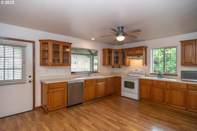 128 NW Woodrose Ct, Roseburg, OR 97471 - kitchen featuring stainless steel appliances, under cabinet range hood, brown cabinets, and recessed lighting