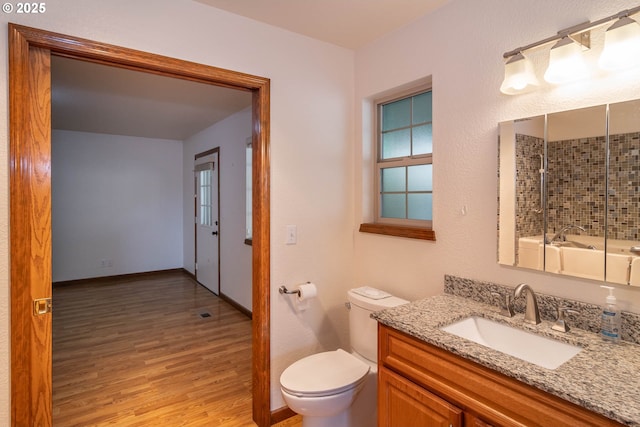 128 NW Woodrose Ct, Roseburg, OR 97471 - bathroom featuring vanity, wood finished floors, and shower / bath combination with glass door