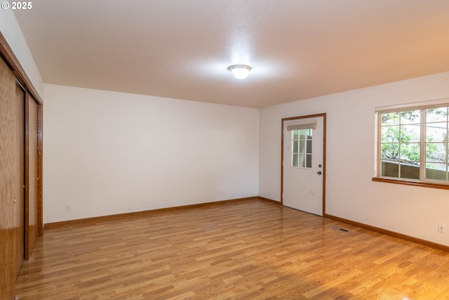 128 NW Woodrose Ct, Roseburg, OR 97471 - spare room featuring light wood finished floors and baseboards