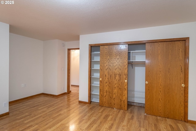 128 NW Woodrose Ct, Roseburg, OR 97471 - unfurnished bedroom with wood finished floors and a closet