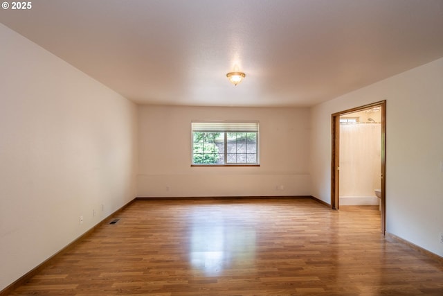 128 NW Woodrose Ct, Roseburg, OR 97471 - empty room with wood finished floors and baseboards