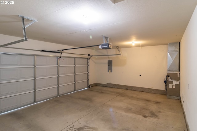 128 NW Woodrose Ct, Roseburg, OR 97471 - garage featuring a garage door opener, electric panel, and heating unit