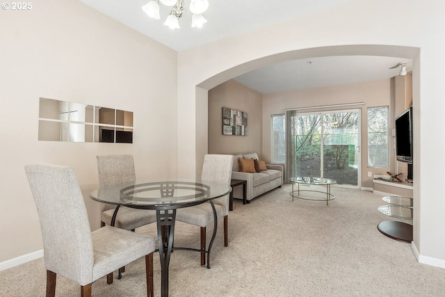 dining room featuring light colored carpet