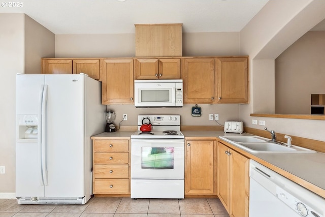 kitchen featuring light brown cabinetry, sink, white appliances, and light tile patterned floors