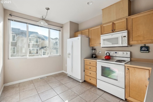 kitchen featuring pendant lighting, white appliances, light brown cabinets, and light tile patterned floors