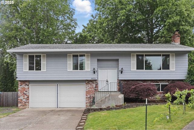 4433 SW 201st Ave, Beaverton, OR 97078 - bi-level home with brick siding, a garage, concrete driveway, and a chimney