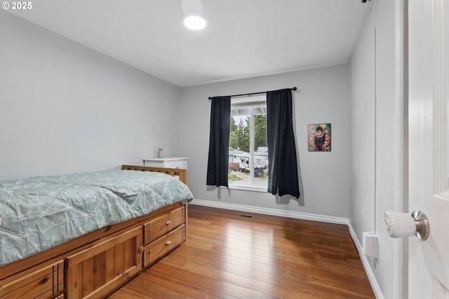 4433 SW 201st Ave, Beaverton, OR 97078 - bedroom featuring wood finished floors and baseboards
