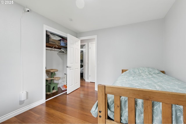 4433 SW 201st Ave, Beaverton, OR 97078 - bedroom featuring wood finished floors, baseboards, and a closet