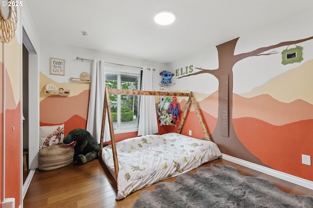 4433 SW 201st Ave, Beaverton, OR 97078 - bedroom featuring wood finished floors and baseboards