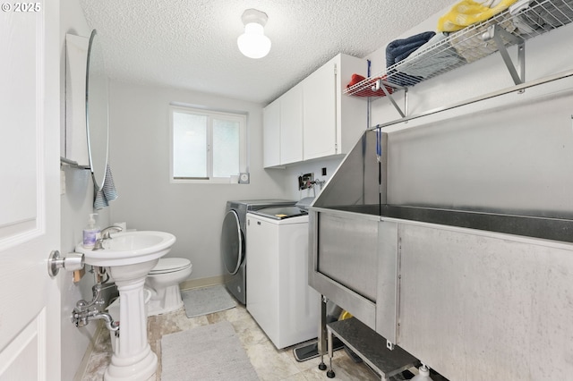 4433 SW 201st Ave, Beaverton, OR 97078 - laundry room featuring separate washer and dryer, baseboards, a textured ceiling, and pet washing area
