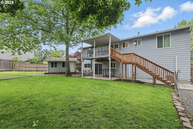 4433 SW 201st Ave, Beaverton, OR 97078 - rear view of house featuring stairway, a wooden deck, an outbuilding, and a patio area