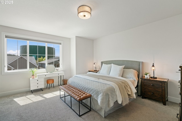 carpeted bedroom with baseboards