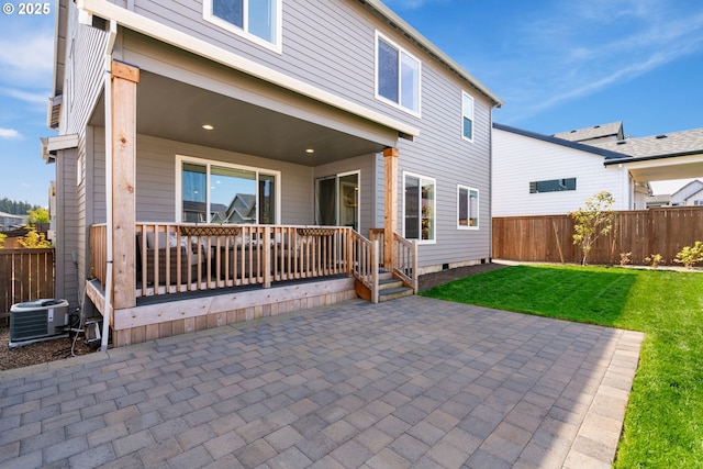 back of house with a lawn, fence, a patio, and central air condition unit