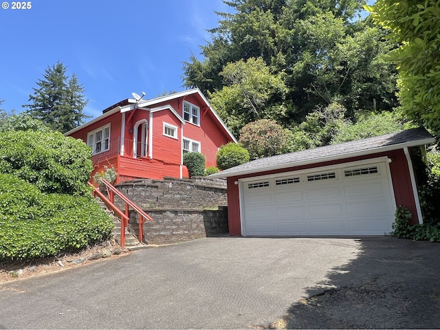 560 N 10th St, Coos Bay, OR 97420 - view of home's exterior with a detached garage and an outdoor structure