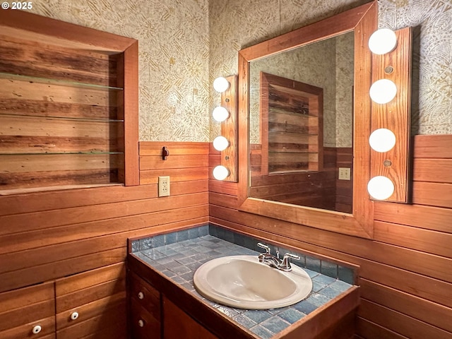 560 N 10th St, Coos Bay, OR 97420 - bathroom featuring wallpapered walls, vanity, a wainscoted wall, and wood walls