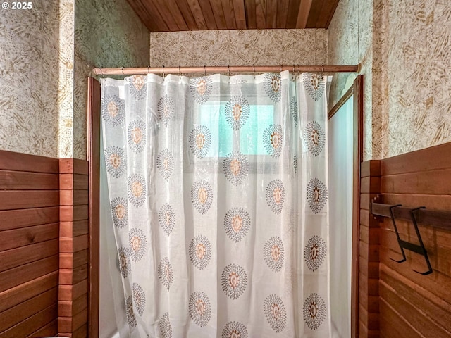 560 N 10th St, Coos Bay, OR 97420 - bathroom with wallpapered walls, curtained shower, and wood ceiling