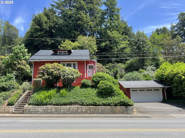 560 N 10th St, Coos Bay, OR 97420 - view of front of home with an outbuilding, driveway, and stairs