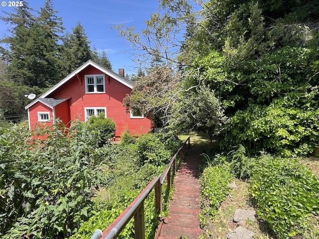560 N 10th St, Coos Bay, OR 97420 - view of home's exterior featuring a chimney