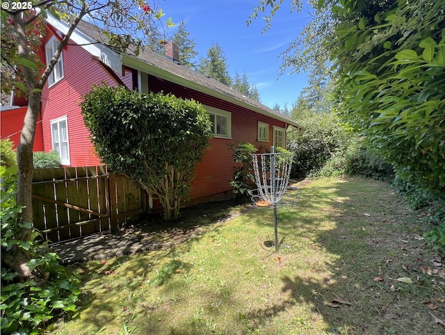 560 N 10th St, Coos Bay, OR 97420 - view of side of home featuring a chimney and roof with shingles