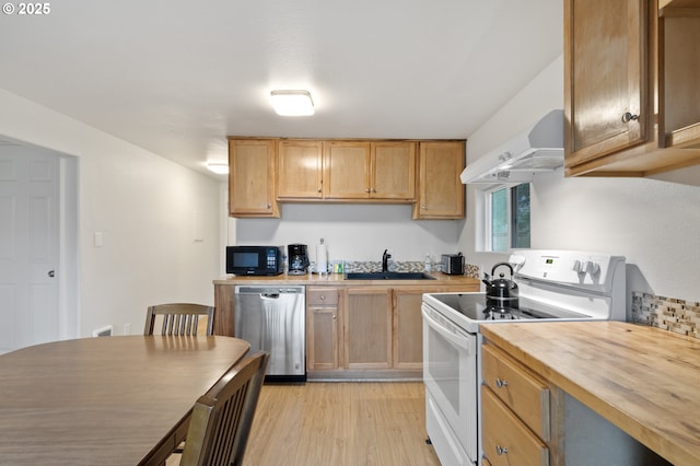 kitchen with a sink, under cabinet range hood, black microwave, dishwasher, and white range with electric stovetop