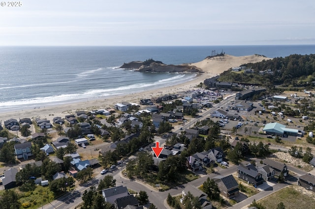 aerial view featuring a view of the beach and a water view