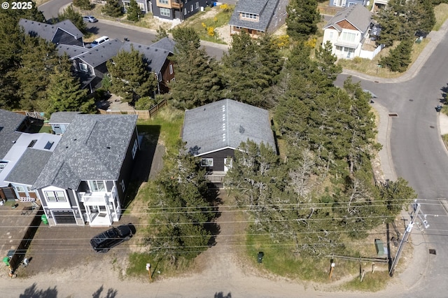 birds eye view of property with a residential view