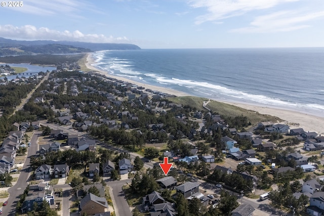 aerial view featuring a residential view, a beach view, and a water view