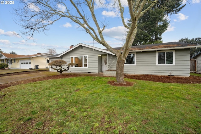 ranch-style home with a garage and a front yard