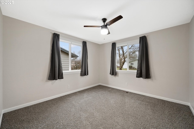 unfurnished room with carpet and ceiling fan