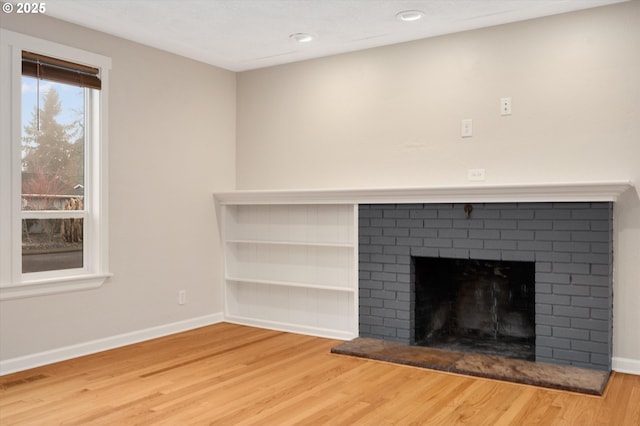 room details featuring hardwood / wood-style flooring and a fireplace