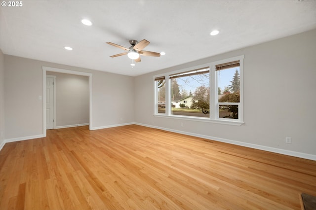 spare room with light hardwood / wood-style flooring and ceiling fan