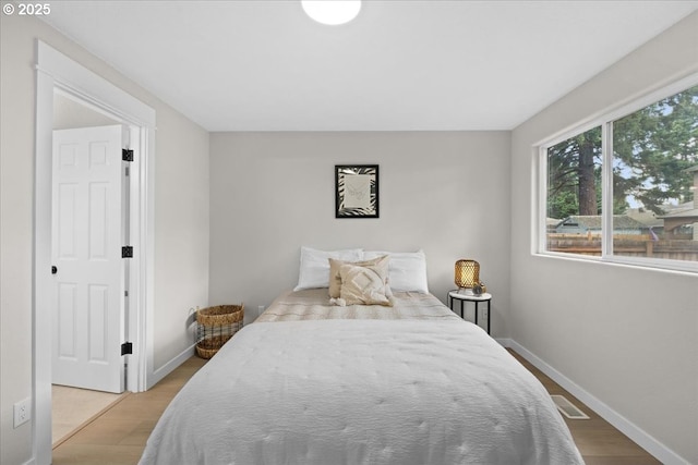 7995 SE Roslyn St, Milwaukie, OR 97222 - bedroom featuring wood finished floors and baseboards