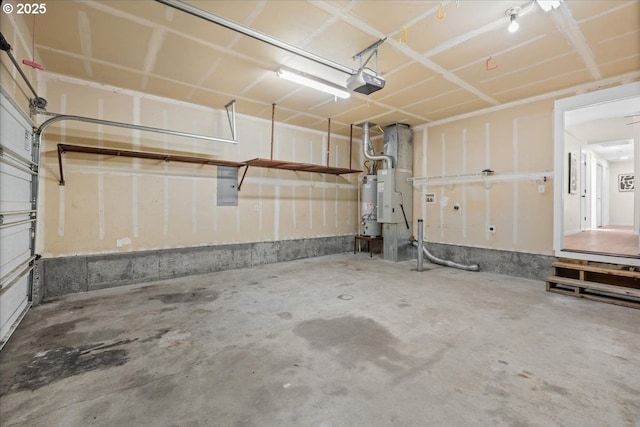 7995 SE Roslyn St, Milwaukie, OR 97222 - garage featuring a garage door opener, strapped water heater, and electric panel