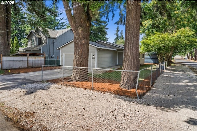 7995 SE Roslyn St, Milwaukie, OR 97222 - view of front of property with concrete driveway and an attached garage