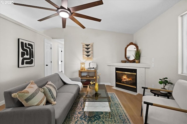 7995 SE Roslyn St, Milwaukie, OR 97222 - living area featuring wood finished floors, a tile fireplace, and ceiling fan