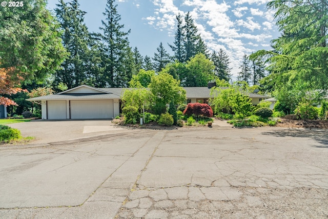 view of front of home with driveway and a garage