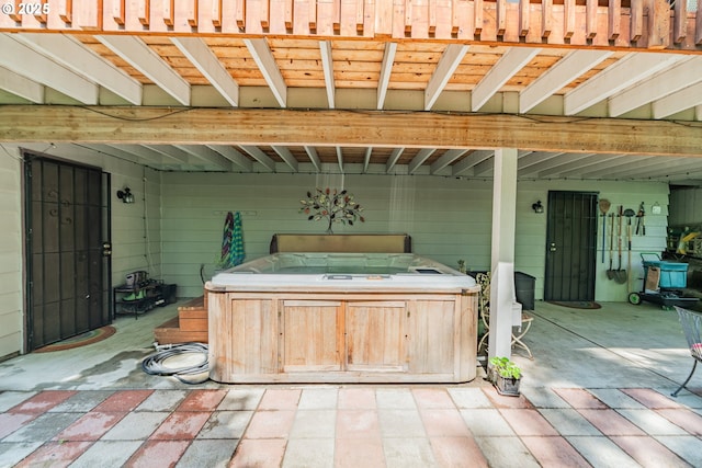 view of patio / terrace with a hot tub