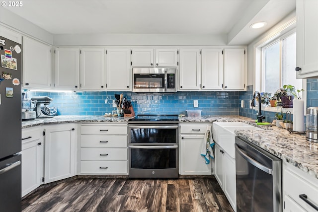 kitchen with white cabinetry and stainless steel appliances