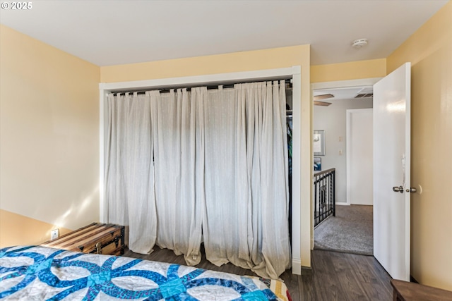 bedroom featuring a closet and dark hardwood / wood-style floors