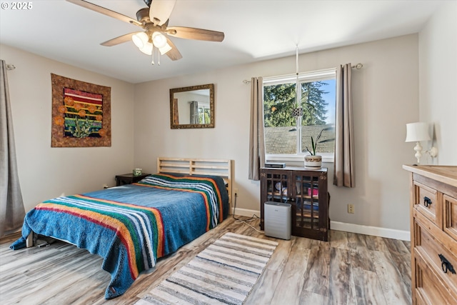 bedroom featuring wood-type flooring and ceiling fan