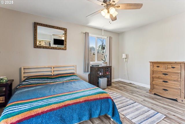 bedroom featuring ceiling fan and light wood-type flooring