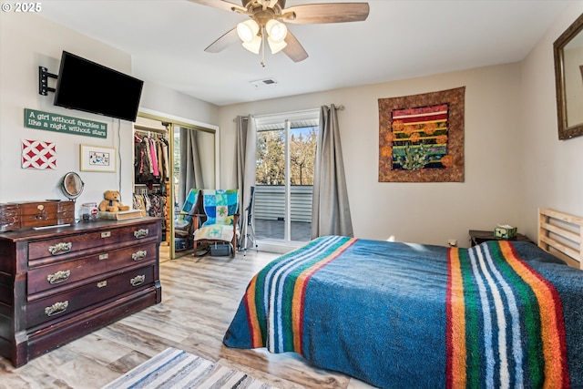 bedroom with access to exterior, light hardwood / wood-style flooring, a closet, and ceiling fan